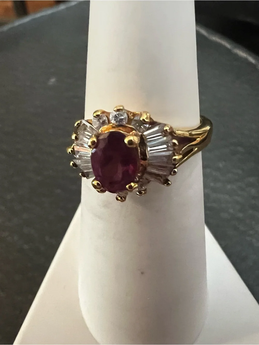 Gold Ring with Ruby-Red Center and Clear Accent Stones